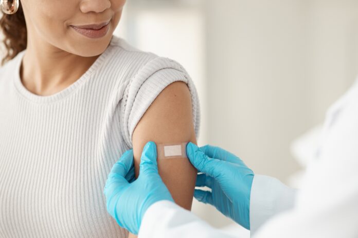Vaccine,,Happy,Woman,And,Hands,Of,Doctor,With,Plaster,For
